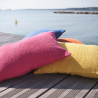 Linen beach cushion front of the sea